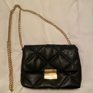 Black leather bag with gold chain strap